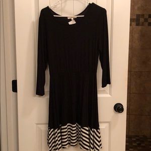 Black long sleeve dress with striped hem
